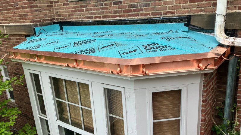 Copper sill drip edge gutter brackets installed